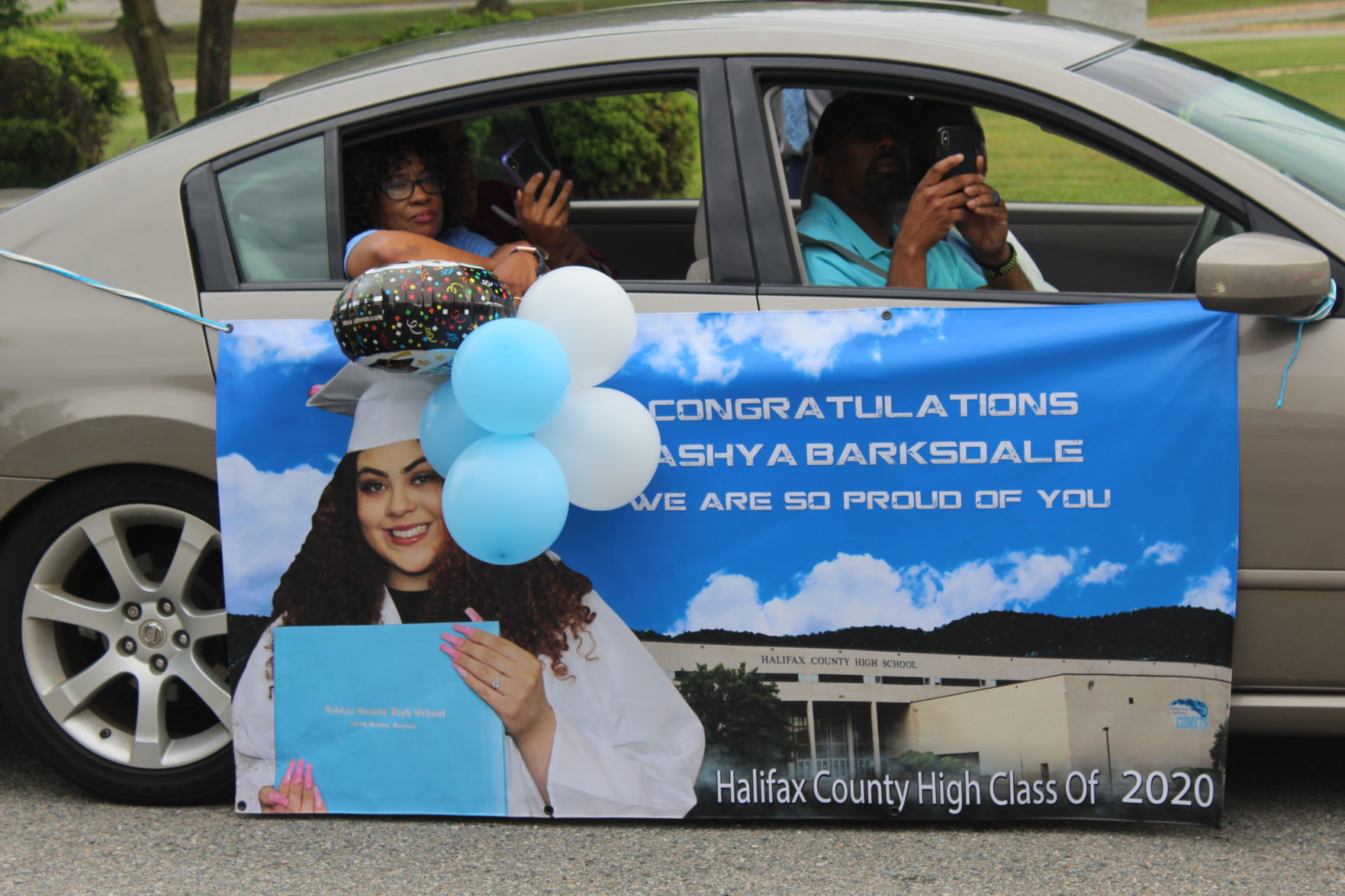 Family with Ashya Barksdale banner.JPG
